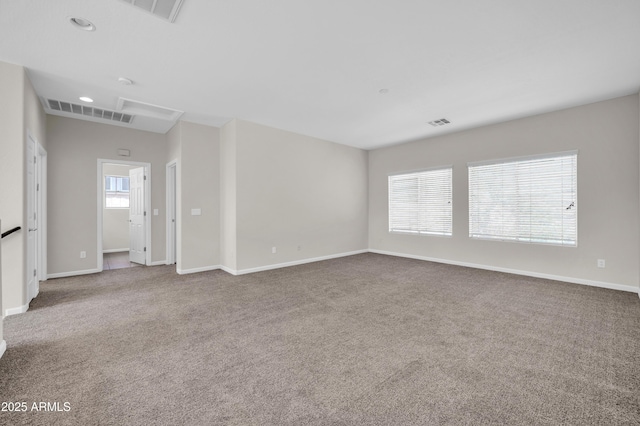 carpeted empty room with recessed lighting, visible vents, and baseboards