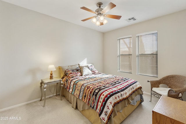 bedroom with light carpet, baseboards, visible vents, and a ceiling fan