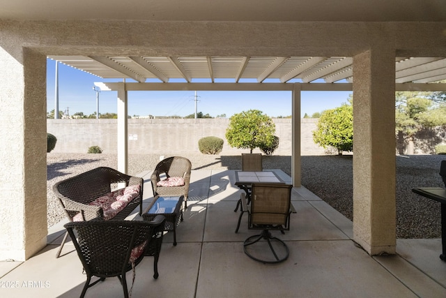 view of patio featuring a fenced backyard, outdoor dining area, and a pergola