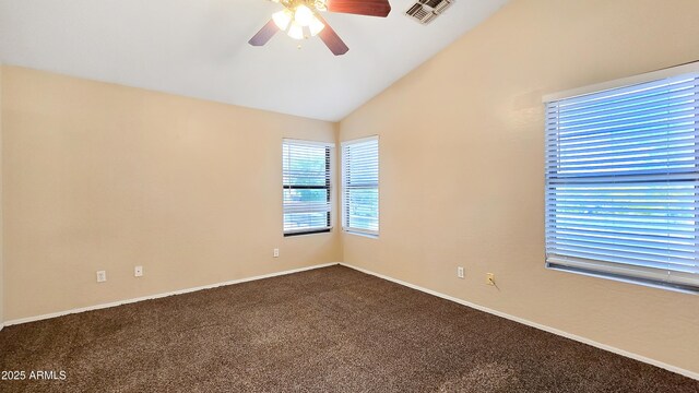 1909 N 106th Ave, Avondale, AZ 85392 - empty room featuring visible vents, baseboards, dark colored carpet, ceiling fan, and vaulted ceiling