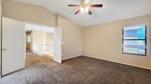 1909 N 106th Ave, Avondale, AZ 85392 - empty room with carpet, baseboards, vaulted ceiling, and ceiling fan
