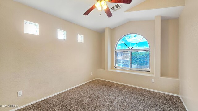 1909 N 106th Ave, Avondale, AZ 85392 - spare room with baseboards, vaulted ceiling, a ceiling fan, carpet floors, and visible vents