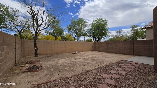 1909 N 106th Ave, Avondale, AZ 85392 - view of yard featuring a patio and a fenced backyard