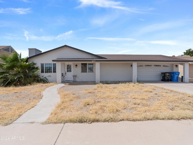 single story home with a garage