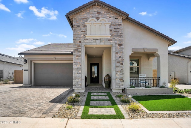 3915 N Shannon Cir, Mesa, AZ 85215 - view of front facade with stucco siding, an attached garage, stone siding, covered porch, and decorative driveway