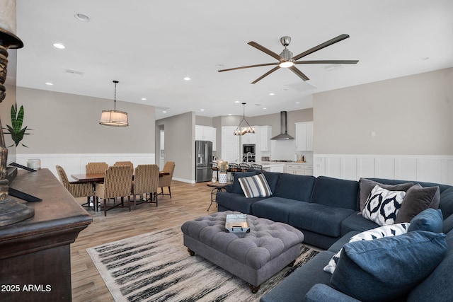3915 N Shannon Cir, Mesa, AZ 85215 - living room with a wainscoted wall, light wood-type flooring, ceiling fan, and recessed lighting