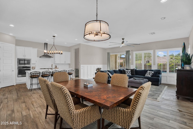 3915 N Shannon Cir, Mesa, AZ 85215 - dining area featuring a chandelier, light wood-type flooring, recessed lighting, and a ceiling fan