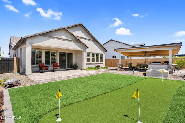 3915 N Shannon Cir, Mesa, AZ 85215 - rear view of property with a putting green, a patio, a fenced backyard, stucco siding, and a bar