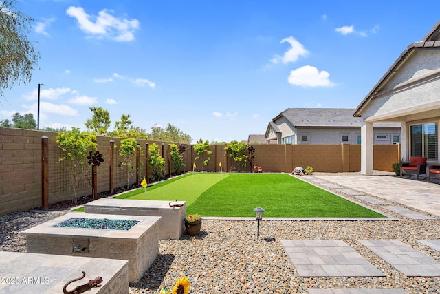 3915 N Shannon Cir, Mesa, AZ 85215 - fenced backyard featuring a patio and a fire pit