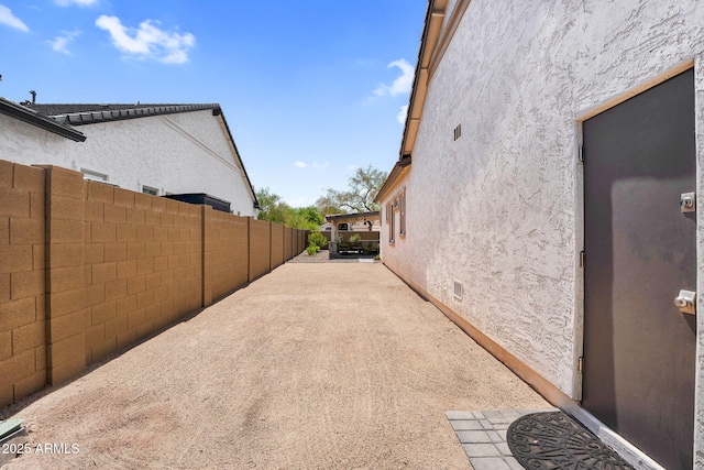 3915 N Shannon Cir, Mesa, AZ 85215 - view of property exterior with stucco siding and a patio area
