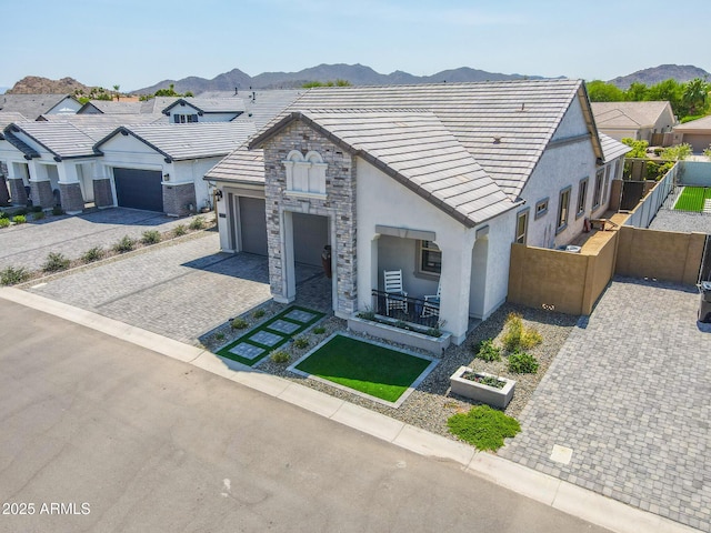 3915 N Shannon Cir, Mesa, AZ 85215 - view of front of home featuring stucco siding, decorative driveway, an attached garage, and a tile roof