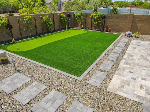 3915 N Shannon Cir, Mesa, AZ 85215 - fenced backyard featuring an area to practice putting and a patio
