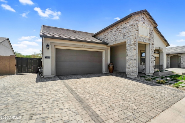 3915 N Shannon Cir, Mesa, AZ 85215 - view of front of home with decorative driveway, a garage, stucco siding, a tiled roof, and a gate