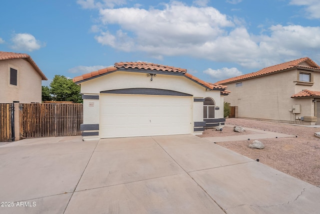 mediterranean / spanish home with a garage