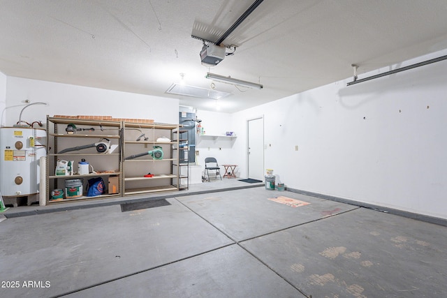 garage featuring water heater and a garage door opener