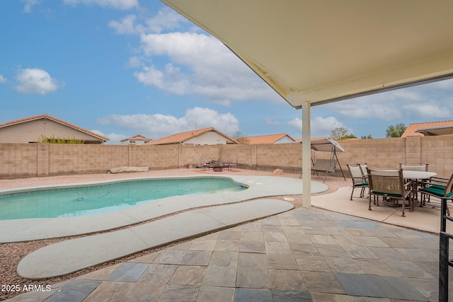 view of swimming pool with a patio