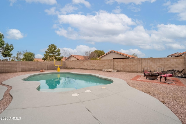 view of pool with a patio area and an outdoor fire pit