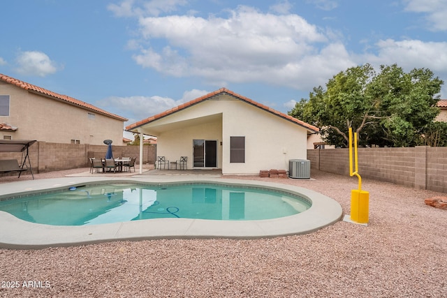 view of swimming pool featuring a patio area and central air condition unit