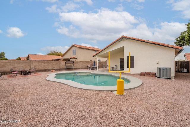 view of pool featuring a patio area and central air condition unit