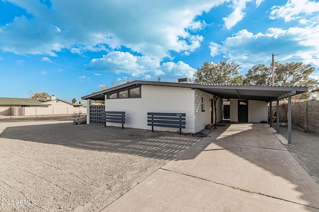 view of front of house with a carport