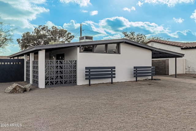 view of side of property featuring an outbuilding