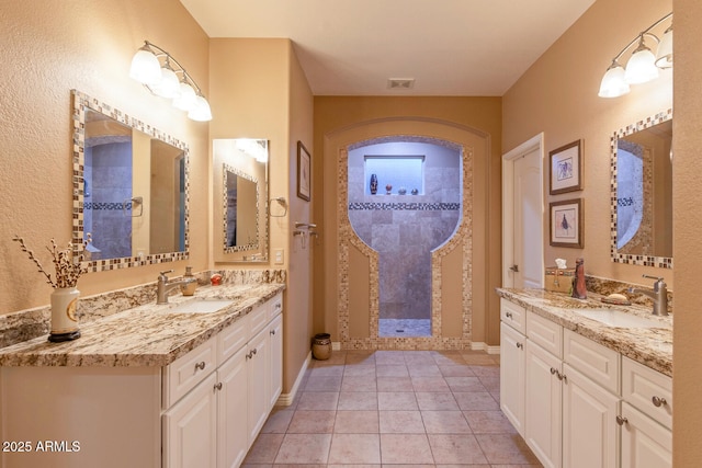 bathroom with vanity and tile patterned floors