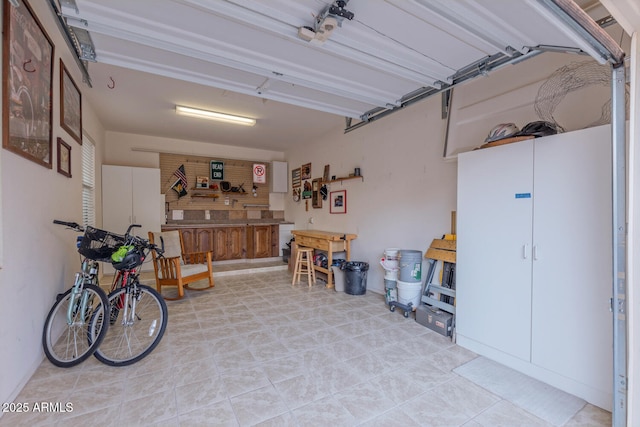 garage with a workshop area