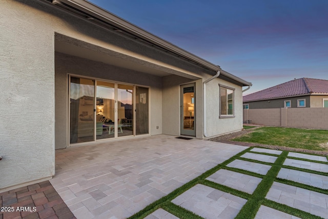 view of patio featuring fence