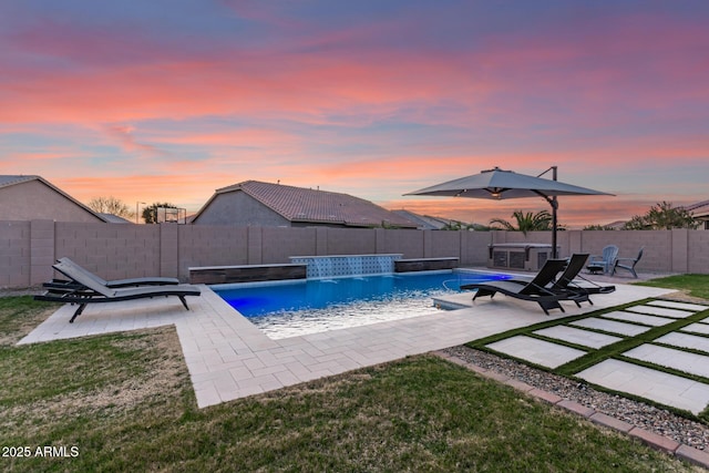 view of swimming pool with a fenced in pool, a fenced backyard, a patio, and a lawn