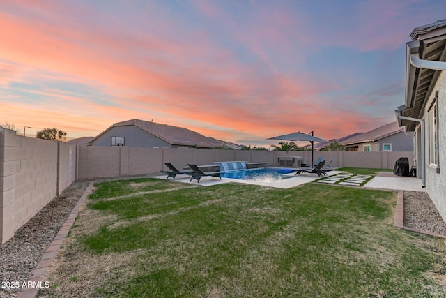 view of yard featuring a patio, a fenced backyard, and a fenced in pool