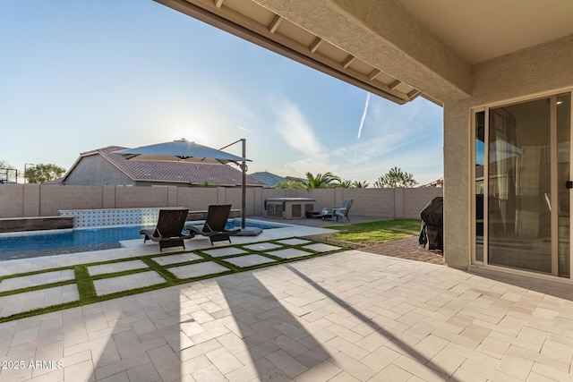 view of patio / terrace with a fenced backyard and a fenced in pool