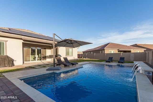 view of swimming pool with a fenced in pool, a fenced backyard, and a patio