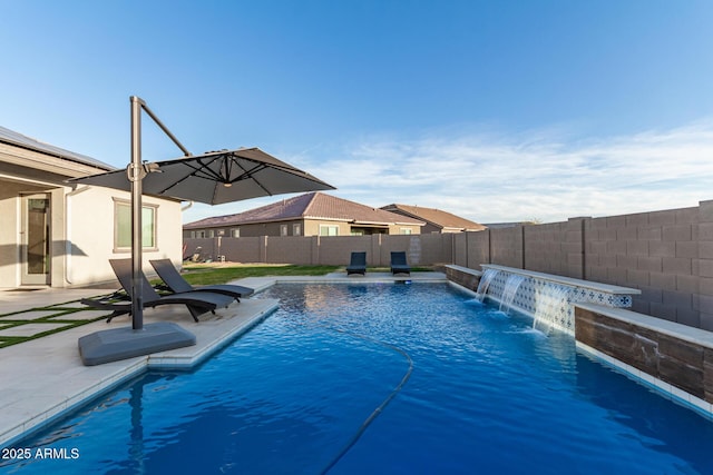 view of swimming pool featuring a patio area, a fenced backyard, and a fenced in pool