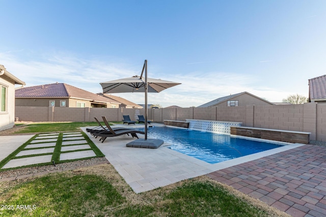 view of swimming pool with a fenced in pool, a patio area, and a fenced backyard