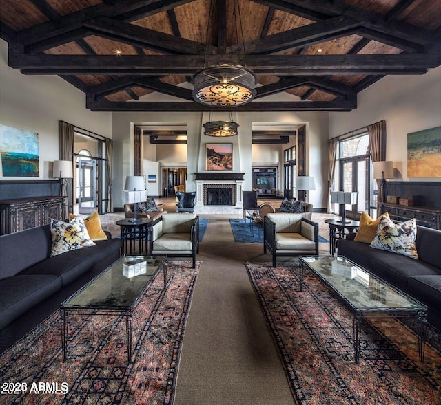 living room featuring beam ceiling, high vaulted ceiling, and wood ceiling