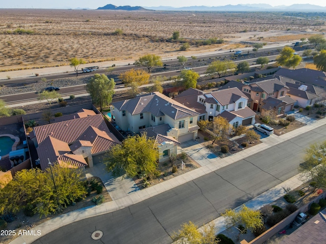 birds eye view of property with a mountain view