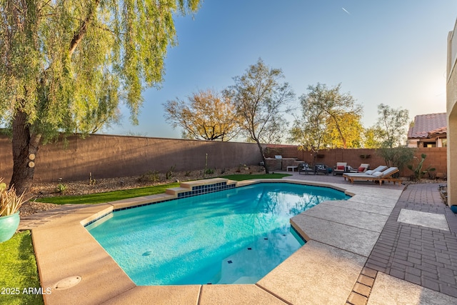 view of pool featuring a patio area