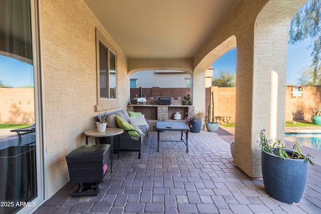 view of patio featuring an outdoor kitchen