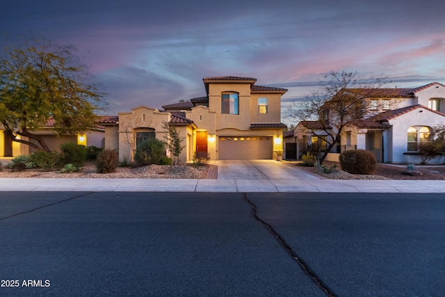 mediterranean / spanish-style house featuring a garage