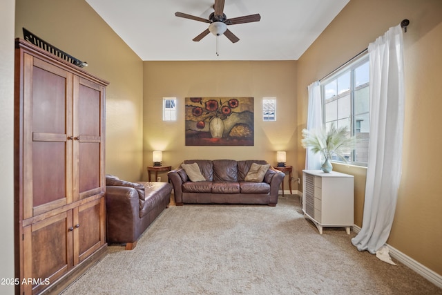 carpeted living room featuring ceiling fan