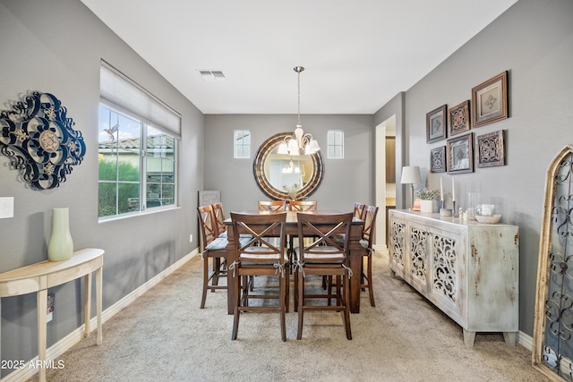 view of carpeted dining area