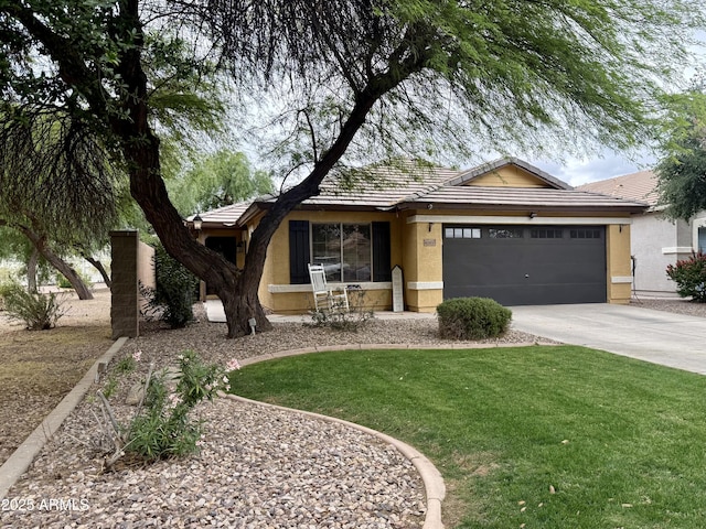 ranch-style home featuring stucco siding, driveway, an attached garage, and a front yard