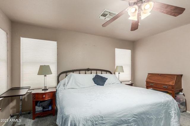 carpeted bedroom featuring ceiling fan and baseboards