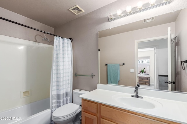bathroom with toilet, vanity, and shower / bath combo with shower curtain