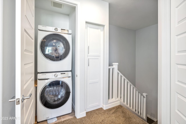 4100 S Pinelake Way Unit 149, Chandler, AZ 85249 - laundry area with stacked washing machine and dryer and carpet