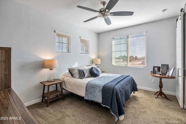 4100 S Pinelake Way Unit 149, Chandler, AZ 85249 - bedroom with a barn door, carpet flooring, and a ceiling fan