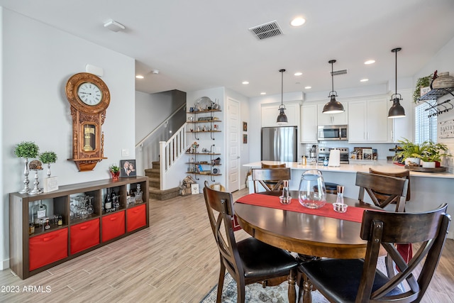 4100 S Pinelake Way Unit 149, Chandler, AZ 85249 - dining space featuring stairs, light wood-type flooring, and recessed lighting