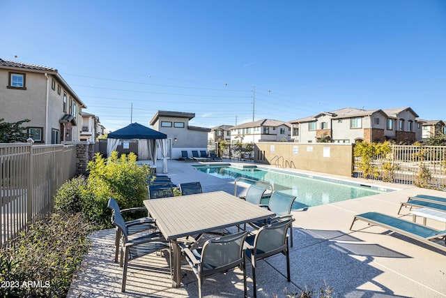 4100 S Pinelake Way Unit 149, Chandler, AZ 85249 - community pool featuring a residential view, a gazebo, and a patio area