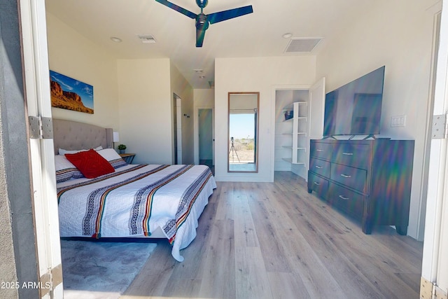 bedroom with wood finished floors and a ceiling fan