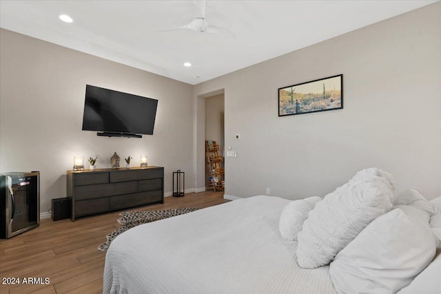 bedroom with ceiling fan and hardwood / wood-style flooring